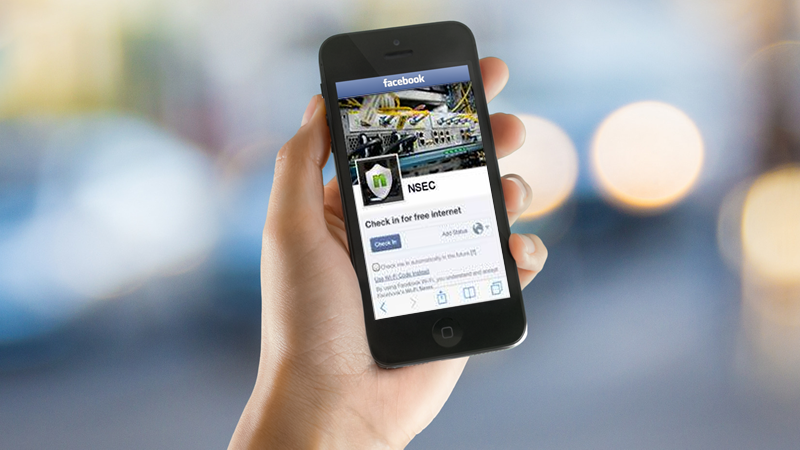 Imagem publicitária da NSEC Brasil mostra como funciona o sistema: Ao invés de senha para acessar à internet, o roteador pede check-ins na página da empresa no Facebook.